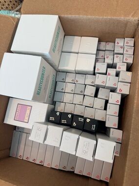 Beautycounter Assorted Lip & Skincare Boxes in White, Black and Pink Accents